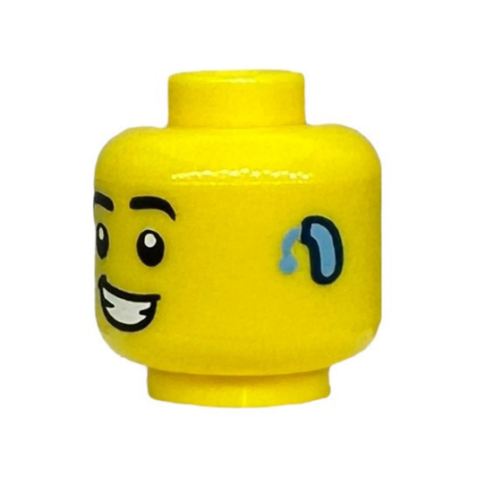 Black Eyebrows, Bright Light Blue Hearing Aid on Left, Lopsided Open Mouth Smile with Teeth